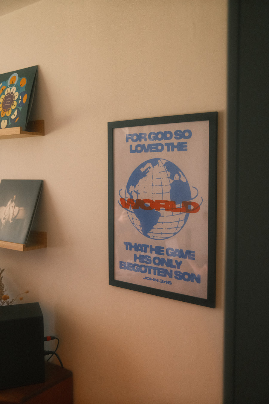 John 3:16 art print on a home wall